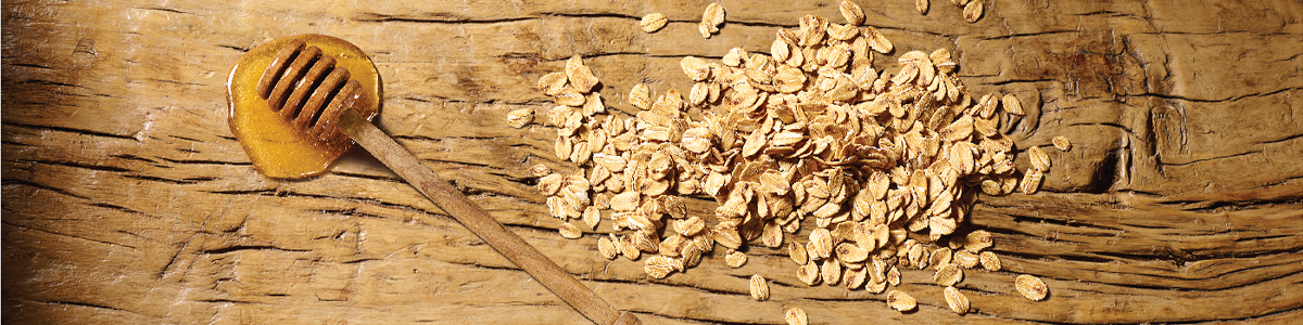 Oats and Honey ingredients on wooden board